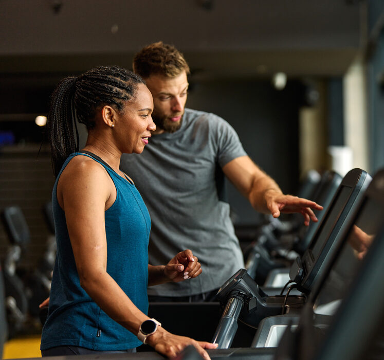 Personal trainer on treadmill